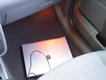 Notebook in the footwell at the passenger